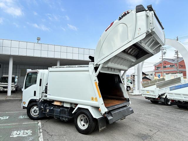 エルフトラック 新明和Ｇ－ＰＸプレス式パッカー・塵芥車・６立米　新明和Ｇ－ＰＸ（ＧＴ０６４）・６立米・プレス式・連続スイッチ・汚水タンク・Ｂモニター・坂道発進補助装置・左電格ミラー・キーレス（13枚目）