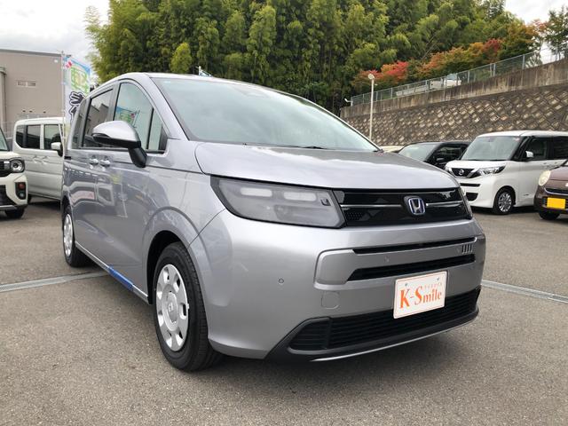 フリード ｅ：ＨＥＶエアー　登録済未使用車　バックカメラ　クリアランスソナー　オートクルーズコントロール　レーンアシスト　衝突被害軽減システム　両側電動スライドドア　オートライト　ＬＥＤヘッドランプ　電動格納ミラー　３列シート（14枚目）