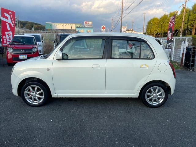 ミラジーノ Ｌ　禁煙車　社外品マフラー　コンビシート　キーレスエントリーキー　純正アルミホイール（１５５／６５Ｒ１４）電動式格納リモコンミラー（17枚目）