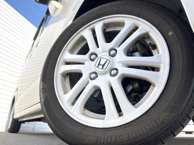 N-BOX G SSパッケージ 純正ナビ 後席モニター バックカメラ 両側電動スライドドア 衝突被害軽減システム 禁煙車 シートヒーター スマートキー HIDヘッドライト ETC オートライト オートエアコン 純正14インチAW(16枚目)