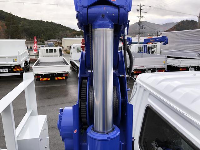 ファイター 　増トン　４段セルフクレーン　重機運搬車　６．７ｔ積載　タダノ　警報仕様　ウインチ　あゆみ板付　５．７ｍボディ　横根太増し強化　ワイド幅　ベッド付（22枚目）