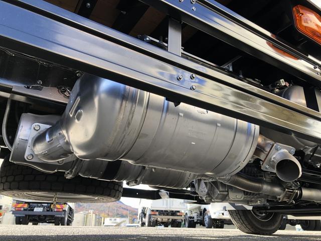 ファイター 　増トン　４段セルフクレーン　重機運搬車　６．７ｔ積載　タダノ　警報仕様　ウインチ　あゆみ板付　５．７ｍボディ　横根太増し強化　ワイド幅　ベッド付（59枚目）