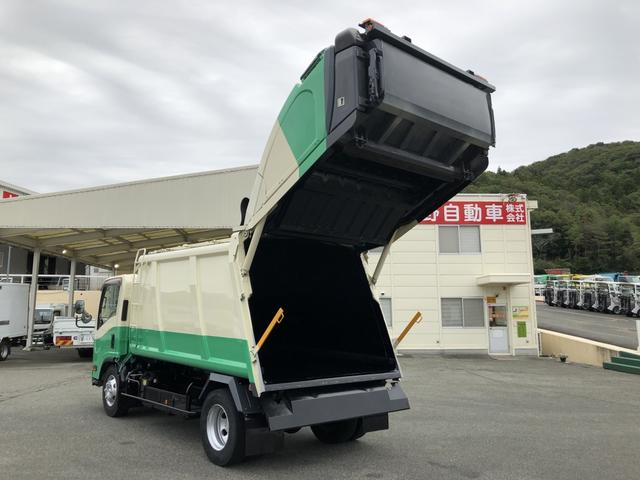 エルフトラック プレス式パッカー車 8.4m3 新明和工業製 2550kg積載 セミATスムーサーEx 連続積込 汚水タンク付 ワイド幅 ロング(2枚目)