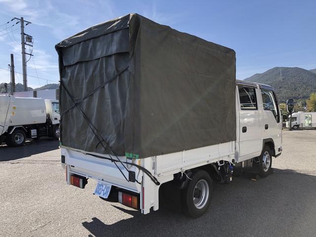 アトラストラック Wキャブ 平ボディ 新明和垂直パワーゲート付 6人乗り 1550kg積載 標準幅 10尺 低床 4ナンバー 5速MT 脱着式幌付(4枚目)