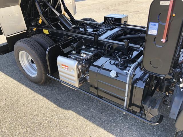 デュトロ 回転ダンプ式パッカー車 4.7m3 極東開発工業製 2トン積載 連続積込 汚水タンク付 標準幅 10尺規格 6速MT アドブルー不要 150馬力(34枚目)