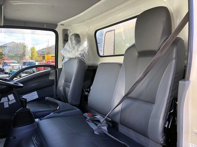 エルフトラック 　プレス式パッカー車　６．０ｍ３　新明和工業製　２９５０ｋｇ積載　連続積込　汚水タンク付　逆流防止装置　ワイド幅　１１尺ミドル　６速ＭＴ（62枚目）