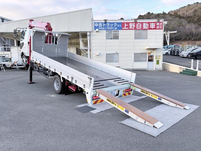 ファイター 　増トン　６段セルフクレーン　重機運搬車　古河ユニック　警報仕様　５．８トン積載　５．５ｍボディ　標準幅　ベッド付　　サニックス製造りボディ　あゆみ板付（2枚目）