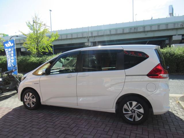 フリードハイブリッド ハイブリッド・Ｇホンダセンシング　純正ナビ　追突軽減ブレーキ　サイドカーテンエアバック　両側パワースライドドア　禁煙車　前方ドラレコ　レーンキープアシスト　スマートキー　ＥＴＣ　バックカメラ　オートＬＥＤヘッドライト　２列目窓カーテン（34枚目）