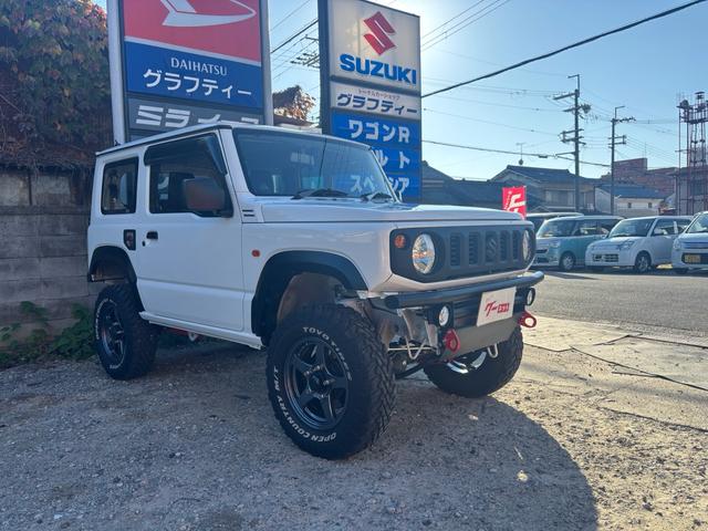 ジムニー ＸＧ　ワンオーナー・ターボ・ガレージ保管車・４ＷＤ・５ＭＴ・禁煙車・リフトアップ・外品マフラー・外品ホイル・ナビ・ＴＶ・Ｂｌｕｅｔｏｏｔｈオーディオ機能・シートカバー（3枚目）