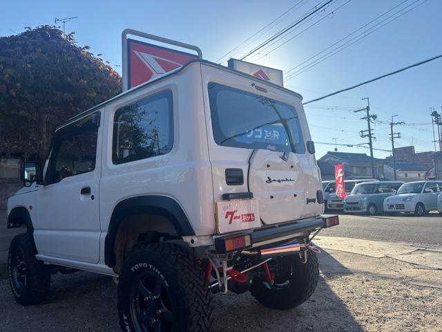ジムニー ＸＧ　ワンオーナー・ターボ・ガレージ保管車・４ＷＤ・５ＭＴ・禁煙車・リフトアップ・外品マフラー・外品ホイル・ナビ・ＴＶ・Ｂｌｕｅｔｏｏｔｈオーディオ機能・シートカバー（6枚目）