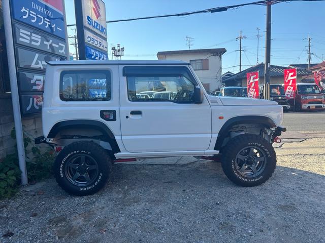 ジムニー ＸＧ　ワンオーナー・ターボ・ガレージ保管車・４ＷＤ・５ＭＴ・禁煙車・リフトアップ・外品マフラー・外品ホイル・ナビ・ＴＶ・Ｂｌｕｅｔｏｏｔｈオーディオ機能・シートカバー（7枚目）