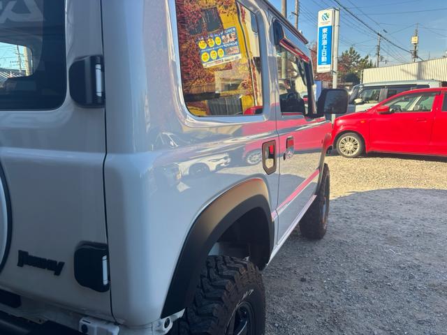 ジムニー ＸＧ　ワンオーナー・ターボ・ガレージ保管車・４ＷＤ・５ＭＴ・禁煙車・リフトアップ・外品マフラー・外品ホイル・ナビ・ＴＶ・Ｂｌｕｅｔｏｏｔｈオーディオ機能・シートカバー（10枚目）