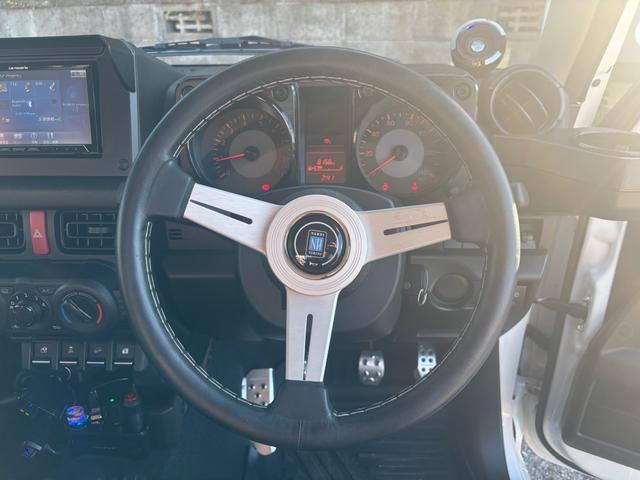 ジムニー ＸＧ　ワンオーナー・ターボ・ガレージ保管車・４ＷＤ・５ＭＴ・禁煙車・リフトアップ・外品マフラー・外品ホイル・ナビ・ＴＶ・Ｂｌｕｅｔｏｏｔｈオーディオ機能・シートカバー（47枚目）