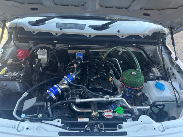 ジムニー ＸＧ　ワンオーナー・ターボ・ガレージ保管車・４ＷＤ・５ＭＴ・禁煙車・リフトアップ・外品マフラー・外品ホイル・ナビ・ＴＶ・Ｂｌｕｅｔｏｏｔｈオーディオ機能・シートカバー（54枚目）