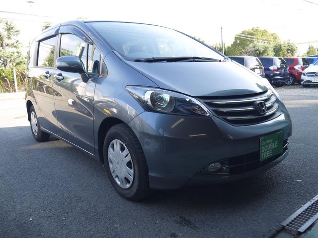 フリード フレックス ジャストセレクション 1年保証付き 電動スライドドア 純正エアロ 地デジTV ナビ 携帯リンク バックカメラ HIDオートライト 安全ボディ 禁煙車 キーレス ABS 電格ミラー ウォークスルー Wエアーバック(3枚目)