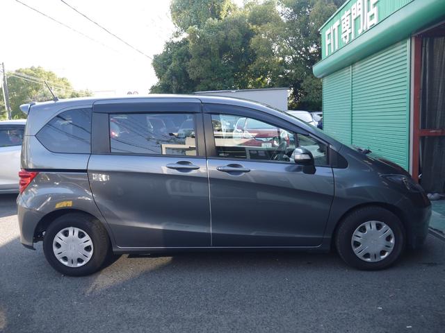 フリード フレックス ジャストセレクション 1年保証付き 電動スライドドア 純正エアロ 地デジTV ナビ 携帯リンク バックカメラ HIDオートライト 安全ボディ 禁煙車 キーレス ABS 電格ミラー ウォークスルー Wエアーバック(4枚目)