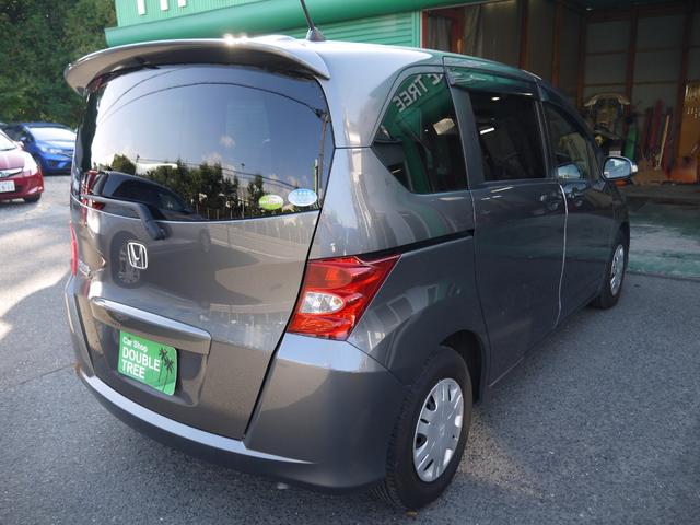 フリード フレックス ジャストセレクション 1年保証付き 電動スライドドア 純正エアロ 地デジTV ナビ 携帯リンク バックカメラ HIDオートライト 安全ボディ 禁煙車 キーレス ABS 電格ミラー ウォークスルー Wエアーバック(5枚目)