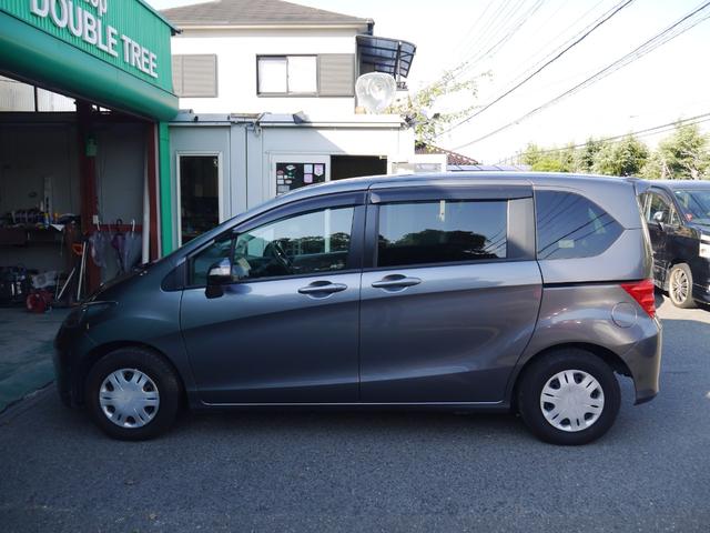 フリード フレックス ジャストセレクション 1年保証付き 電動スライドドア 純正エアロ 地デジTV ナビ 携帯リンク バックカメラ HIDオートライト 安全ボディ 禁煙車 キーレス ABS 電格ミラー ウォークスルー Wエアーバック(8枚目)