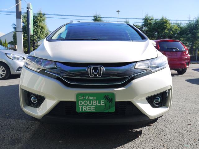 フィットハイブリッド Fパッケージ 2年保証付き 衝突軽減ブレーキ スマートキー プッシュスタート 地デジTV ナビ Bluetooth対応 バックカメラ HIDオートライト 安全ボディ 禁煙車 ABS 電格ミラー Wエアーバック(2枚目)