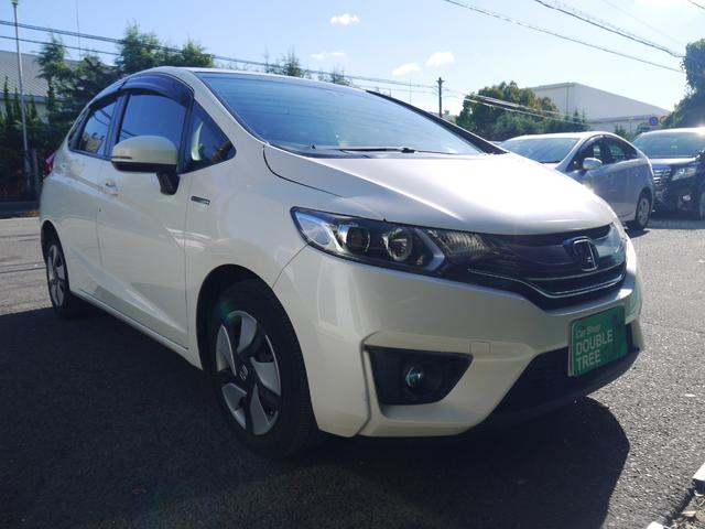 フィットハイブリッド Fパッケージ 2年保証付き 衝突軽減ブレーキ スマートキー プッシュスタート 地デジTV ナビ Bluetooth対応 バックカメラ HIDオートライト 安全ボディ 禁煙車 ABS 電格ミラー Wエアーバック(3枚目)