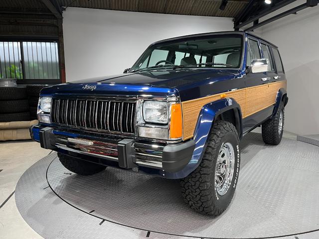 ジープ・チェロキー スポーツ　前期スポーツ・４ＷＤ・同色オールペン済・ウッドシート施工済・新品前後メッキバンパー・新品メッキグリル・新品メッキドアハンドル・ＢＦグッドリッチオールテレーンタイヤ・デイトナホイール新品・ネイビー（7枚目）