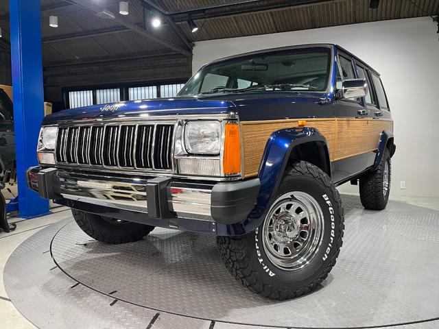 ジープ・チェロキー スポーツ　前期スポーツ・４ＷＤ・同色オールペン済・ウッドシート施工済・新品前後メッキバンパー・新品メッキグリル・新品メッキドアハンドル・ＢＦグッドリッチオールテレーンタイヤ・デイトナホイール新品・ネイビー（49枚目）
