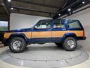 ジープ・チェロキー スポーツ　前期スポーツ・４ＷＤ・同色オールペン済・ウッドシート施工済・新品前後メッキバンパー・新品メッキグリル・新品メッキドアハンドル・ＢＦグッドリッチオールテレーンタイヤ・デイトナホイール新品・ネイビー（5枚目）