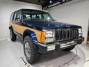 ジープ・チェロキー スポーツ　前期スポーツ・４ＷＤ・同色オールペン済・ウッドシート施工済・新品前後メッキバンパー・新品メッキグリル・新品メッキドアハンドル・ＢＦグッドリッチオールテレーンタイヤ・デイトナホイール新品・ネイビー（6枚目）