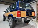 スポーツ　前期スポーツ・４ＷＤ・同色オールペン済・ウッドシート施工済・新品前後メッキバンパー・新品メッキグリル・新品メッキドアハンドル・ＢＦグッドリッチオールテレーンタイヤ・デイトナホイール新品・ネイビー（11枚目）