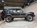 ジープ・チェロキー スポーツ 前期スポーツ・4WD・momoステアリング・リフトアップ・・ブラック・背面タイヤ(4枚目)