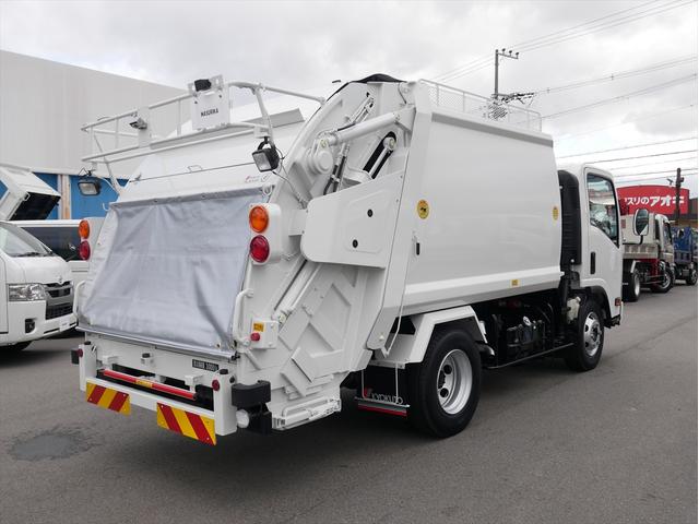 エルフトラック プレス式パッカー車　連続スイッチ　ターボ　３ｔ　塵芥車　プレス式　極東製（ＧＢ６９－２７Ｈ－Ｓ）６．９立米　６速マニュアル／３ペダル　汚水タンク　ＨＳＡ（坂道発進補助装置）　横滑り防止装置　カラーバックモニター　前後ドラレコ　新品タイヤ×６本（6枚目）
