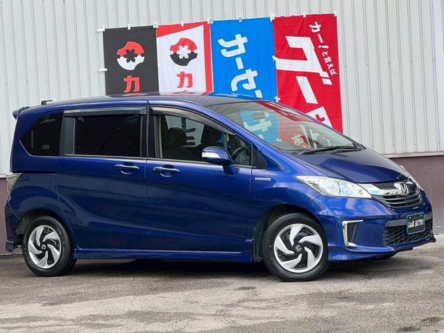 フリードハイブリッド ジャストセレクション　純正ナビ　ワンオーナー　クルコン　両側電動　スマートキー　ＢＬＵＥＴＯＯＴＨ　ステアリモコン　ＨＩＤヘッド　オートライト　フルフラット　ウォークスルー　６人乗り３列シート　横滑り防止　盗難防止　ＥＴＣ（10枚目）