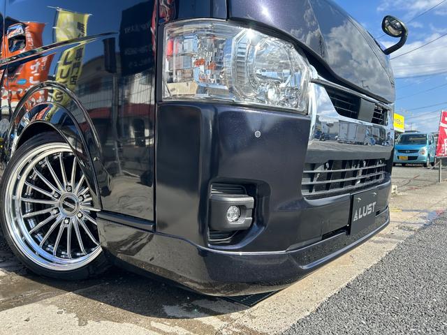 ハイエースバン スーパーGL ダークプライムII 令和3年式・61000km・新品ホイール・EF-19・バッドパネル・ローダウン・フロントスポイラー・シートカバー・7インチナビ・バックカメラ・ETC車載器・車中泊ベッドキット・無償保証(24枚目)