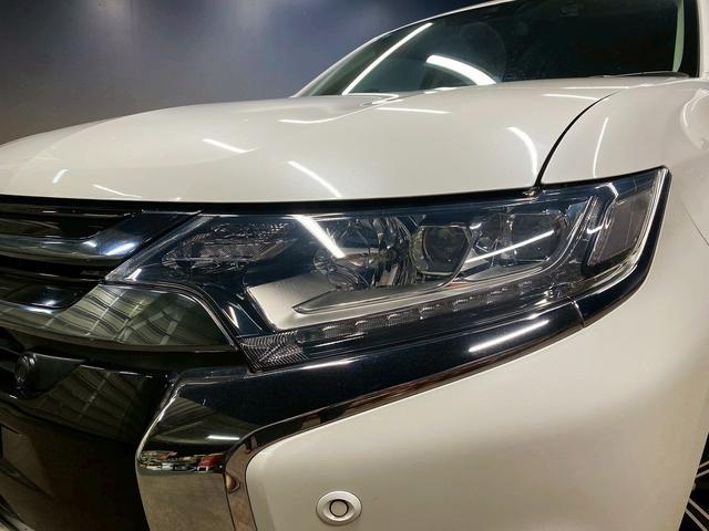 アウトランダーPHEV Gナビパッケージ (禁煙車)(後期型)(4WD)(黒半革)(純正SDナビ)(バックカメラ)(LEDヘッドライト)(クリアランスソナー)(パドルシフト)(パワーシート)(シートヒーター)(ETC)(純正18インチAW)(51枚目)