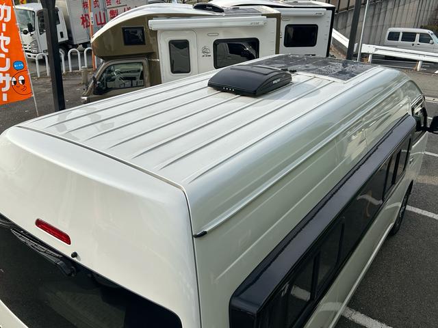 ハイエースバン キャンパー鹿児島 レムBV 家庭用エアコン/常設Wベッド/出窓仕様/CTEK走行充電器/FFヒーター/1500Wインバーター/トリプルサブBT/ソーラーパネル/マックスファン/電子レンジ/冷蔵庫/リアTV/純正Aw/TSS/(35枚目)