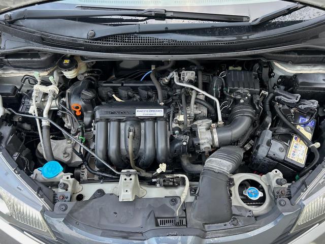 フィット １３Ｇ・Ｆパッケージ　純正ナビ　禁煙　バックカメラ　衝突軽減ブレーキ　誤発進抑制機能　アイドリングストップ　Ｂｌｕｅｔｏｏｔｈ再生　ＤＶＤ再生　地デジＴＶ　シートリフター　スマートキー　プッシュスタート　横滑り防止装置（18枚目）