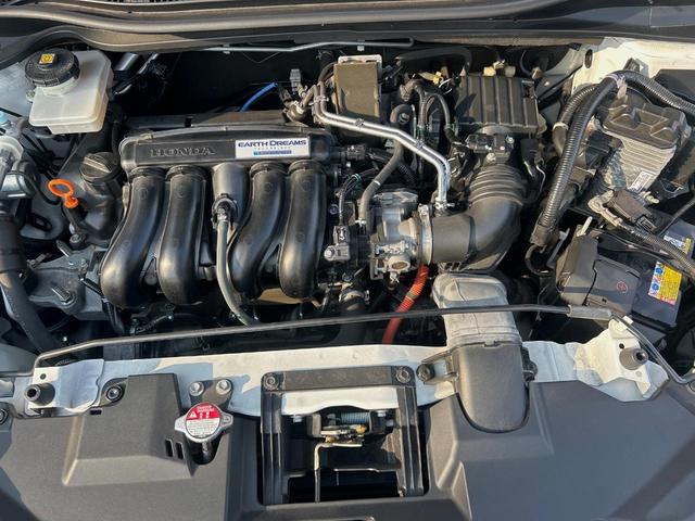 ヴェゼル ハイブリッドＺ・ホンダセンシング　ホンダセンシング／レーダークルーズ／純正ナビ／車線逸脱警報／バックカメラ／ＥＴＣ／ＬＥＤヘッド／前席シートヒーター／デュアルオートエアコン／パドルシフト／ハーフレザー／電子パーキング（18枚目）