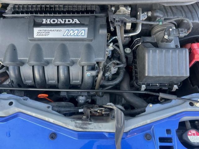 フィットハイブリッド ナビプレミアムセレクション　純正ナビ　禁煙車　バックカメラ　ＥＴＣ　クルーズコントロール　パドルシフト　シートヒーター　革巻きステアリング　純正１５インチアルミ　横滑り防止装置　スマートキー（18枚目）