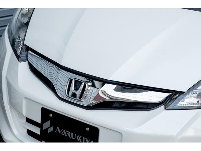 フィット 15XH ファインスタイル GE8最終モデル特別仕様車15XHファインスタイル!記録簿9枚・メモリナビ・Bカメラ・地デジ・HID・無限サス・専用15インチAW・専用メッキグリル&リアガーニッシュ・専用ブラウン内装・新品シフトノブ(14枚目)