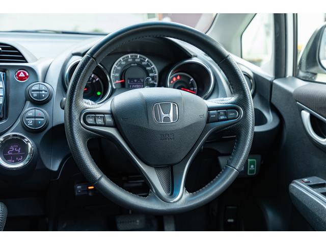 フィット 15XH ファインスタイル GE8最終モデル特別仕様車15XHファインスタイル!記録簿9枚・メモリナビ・Bカメラ・地デジ・HID・無限サス・専用15インチAW・専用メッキグリル&リアガーニッシュ・専用ブラウン内装・新品シフトノブ(26枚目)