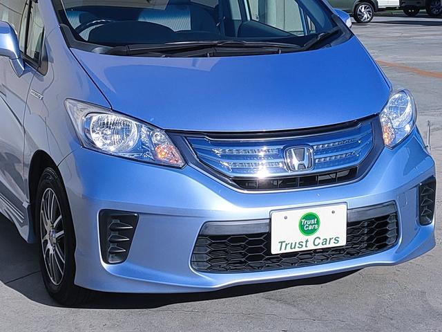 フリードハイブリッド ジャストセレクション　禁煙車／７人乗り／パワスラ／クルーズコントロール／ＥＴＣ／ナビ／Ｂカメラ／Ｂｌｕｅｔｏｏｔｈ／フルセグ／ＤＶＤ再生／ＣＤ／スマートキー／社外１５ＡＷ／オートエアコン／タイミングチェーン／ＩＳＯＦＩＸ（3枚目）