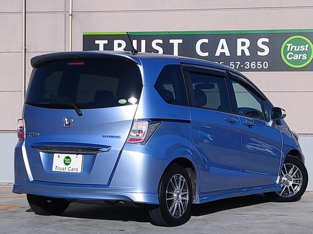 フリードハイブリッド ジャストセレクション　禁煙車／７人乗り／パワスラ／クルーズコントロール／ＥＴＣ／ナビ／Ｂカメラ／Ｂｌｕｅｔｏｏｔｈ／フルセグ／ＤＶＤ再生／ＣＤ／スマートキー／社外１５ＡＷ／オートエアコン／タイミングチェーン／ＩＳＯＦＩＸ（10枚目）