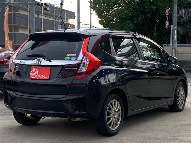 フィットハイブリッド Ｌパッケージ　衝突軽減ブレーキ　メモリーナビ　バックカメラ　地デジＴＶ　クルーズコントロール　ＥＴＣ　ＬＥＤヘッドライト　スマートキー　社外１５インチアルミホイール（7枚目）