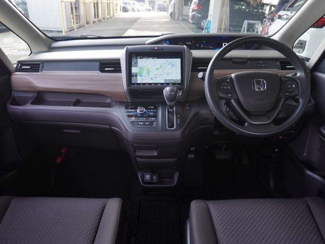 フリード Ｇ・ホンダセンシング　ワンオーナー車　９インチナビ　両側電動スライドドア　シートヒーター　バックカメラ　ＥＴＣ　ＤＶＤ　Ｂｌｕｅｔｏｏｔｈ　ＬＥＤオートライト　衝突被害軽減ブレーキ　いまコレ＋（用品のフロアマットが新品）（7枚目）
