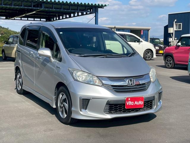 フリードハイブリッド ジャストセレクション メモリーナビ ワンセグTV リアカメラ スマートキー HIDヘッドライト 両側パワスラ Bluetooth クルコン 純正15インチ鉄 ETC(2枚目)