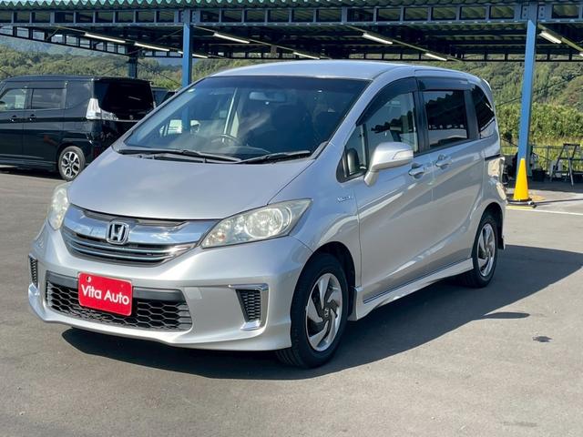 フリードハイブリッド ジャストセレクション メモリーナビ ワンセグTV リアカメラ スマートキー HIDヘッドライト 両側パワスラ Bluetooth クルコン 純正15インチ鉄 ETC(5枚目)