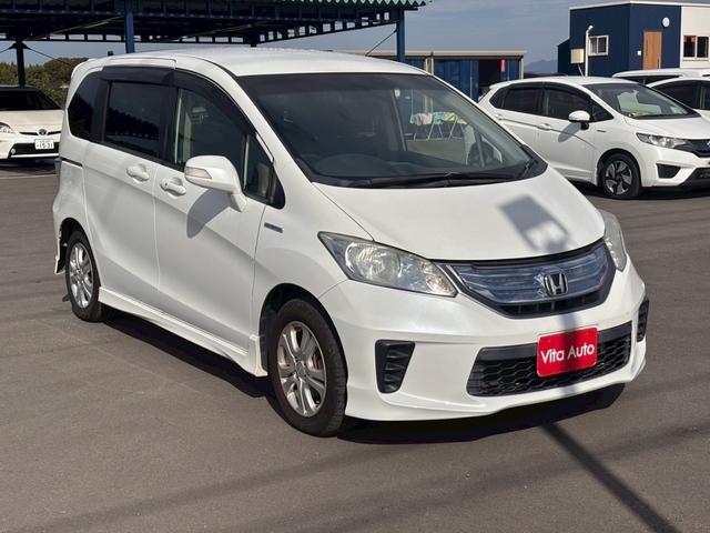 フリードハイブリッド ジャストセレクション メモリーナビ フルセグTV リアカメラ フリップダウンモニター スマートキー HIDヘッドライト 両側パワスラ Bluetooth クルコン 社外15インチアルミ ETC(3枚目)