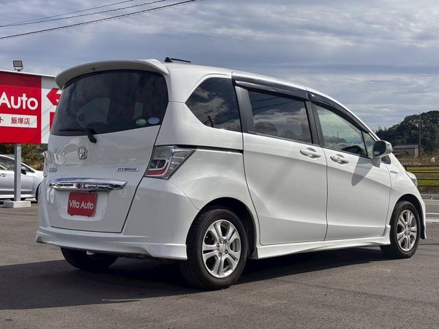 フリードハイブリッド ジャストセレクション メモリーナビ フルセグTV リアカメラ フリップダウンモニター スマートキー HIDヘッドライト 両側パワスラ Bluetooth クルコン 社外15インチアルミ ETC(14枚目)