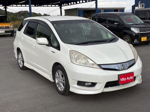 フィットシャトルハイブリッド ハイブリッド・スマートセレクション　ファインライン　メモリーナビ　ワンセグＴＶ　リアカメラ　スマートキー　ＨＩＤヘッドライト　シートヒーター　クルコン　社外１５インチアルミ　ＥＴＣ（2枚目）