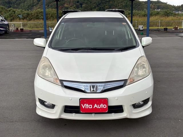 フィットシャトルハイブリッド ハイブリッド・スマートセレクション　ファインライン　メモリーナビ　ワンセグＴＶ　リアカメラ　スマートキー　ＨＩＤヘッドライト　シートヒーター　クルコン　社外１５インチアルミ　ＥＴＣ（4枚目）